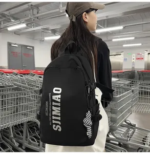 Detailed view of large capacity black school backpack with letter print, student daily commute.