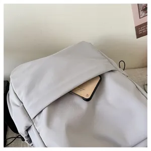 Solid color large capacity backpack detail shot, casual student school bag for daily use.