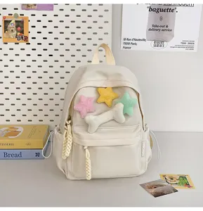 Minimalist ins style canvas backpack with cute plush star and bone decor for students daily use.