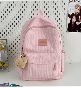 Solid color pleated school backpack for women, casual lightweight travel daypack for students.