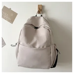 Minimalist solid color large capacity casual backpack for students and daily commuting style.