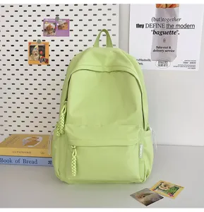 Minimalist light green student backpack detail, casual daily canvas book bag showcase.