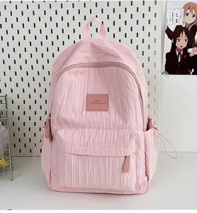 Pink lightweight pleated backpack for daily school travel and casual outdoor activities.