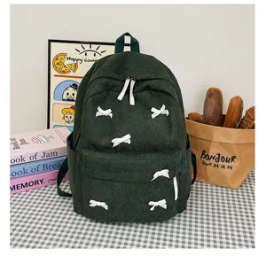 Dark green corduroy backpack with sweet white bows, perfect school bag for teens and students.