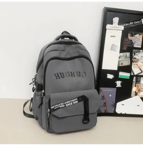 Retro versatile student backpack, large capacity grey bookbag with stylish letter print for school.