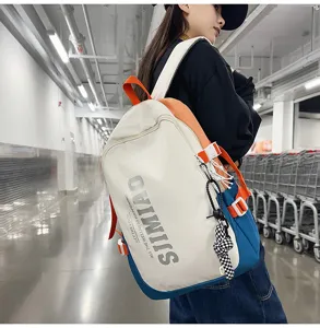 Detail view of large capacity student backpack featuring multi-pocket and trendy colorful design.