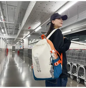Large capacity canvas backpack for students, stylish color block design with multiple pockets.