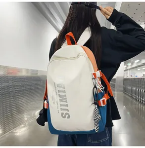 Large capacity casual backpack for students, stylish color block school bag for daily use.