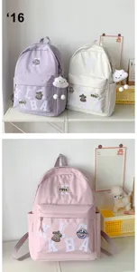 Casual canvas backpack with letter patches and large capacity for daily school and travel use.
