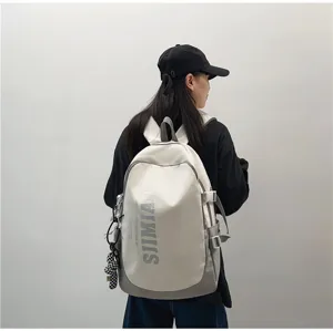 Large capacity school backpack for students, casual grey travel computer bag with letters.