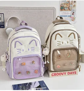 Cute cat ear ita backpack with clear front pocket and kawaii charms, perfect for daily student use.