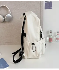 Minimalist large capacity white backpack for students, casual daily school bookbag with pockets.