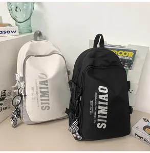 Large capacity school backpack for students, stylish laptop bag with multi pockets and charms.