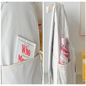 Close up details of the minimalist large capacity backpack showing front and side pockets.