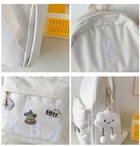 Minimalist canvas backpack with letter embroidery and cute cloud pendant for school.