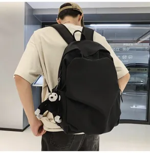 Black large capacity backpack casual school daypack with cute monkey pendant for daily use