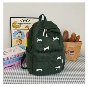Japanese style dark green corduroy backpack with cute white bows for women and students.