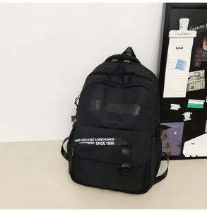 Casual black backpack detail shot, retro college style, large capacity laptop bag for students.