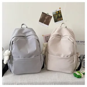 Solid color large capacity casual backpack school bag for students and daily commuting