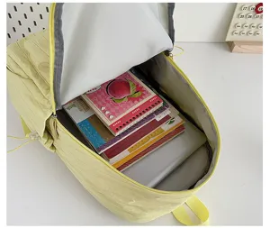 Solid color lightweight casual backpack detail view showing large capacity interior storage space.