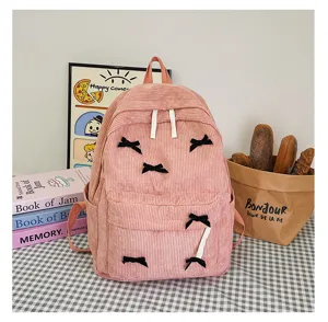 Japanese ins style pink corduroy backpack for girls, cute bow college school bag.