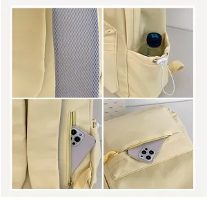 Close-up details of casual yellow student backpack showing mesh strap, side pocket, and zipper.