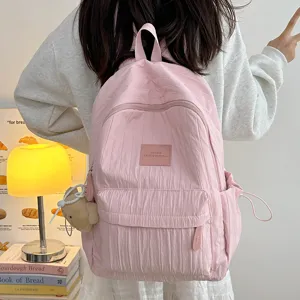 Pink casual backpack for women and girls, lightweight school bookbag with cute bear pendant.