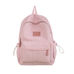 Pink casual backpack for women and girls, lightweight school bookbag with front pocket and straps.