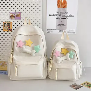 Minimalist student backpack set with cute plush star bone patches in soft beige canvas style