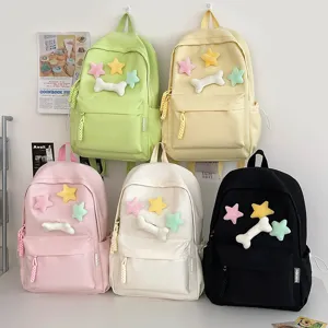 Cute student casual backpack with plush star and bone decorations for daily school use.