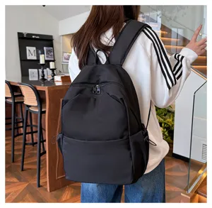 Casual black backpack large capacity solid color school bag for students and daily commuting.