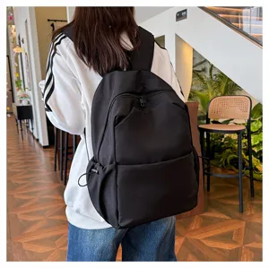 Solid color large capacity casual backpack for students and daily commute in black.