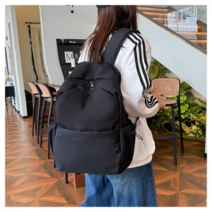 Detail view of a minimalist solid color large capacity backpack, perfect for daily school and travel.