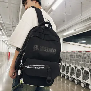 Classic black canvas backpack for students, large capacity casual daily school bookbag.