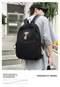 Casual large capacity campus backpack solid color student school bag for men daily use.