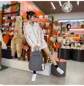 Grey corduroy backpack large capacity casual school travel bag for students daily use and fashion matching.
