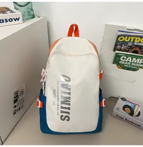 Stylish color block canvas backpack with large capacity for students and daily use.