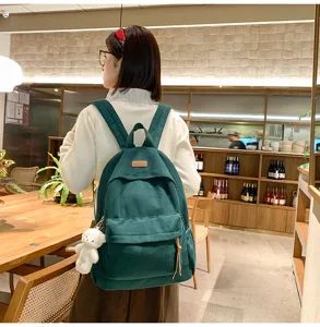 Large capacity corduroy backpack for women, trendy school bag for students and travel use.