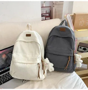 Corduroy student backpack detail view, large capacity casual daily school bag for teen girls.