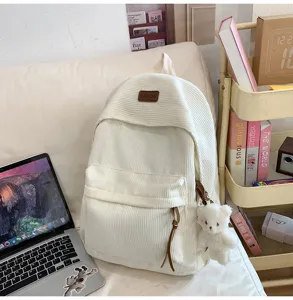 Niche ins style corduroy backpack with cute bear pendant, large capacity school bag for girls.