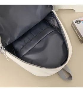Backpack interior detail view showcasing spacious main compartment and lining structure for daily use.