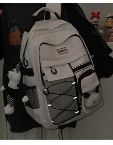Utility style white school backpack detail, large capacity design with mesh pockets and straps.
