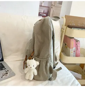Corduroy backpack for women, casual school bookbag with cute bear pendant, large capacity daily bag.