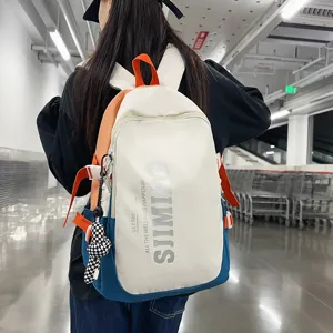 Large capacity student school backpack with stylish color blocking, laptop casual bag.