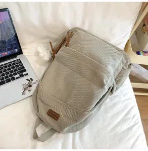 Casual corduroy backpack for women and students, large capacity daily school bag with pocket.