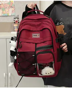 Red utility backpack for middle school students, large capacity casual bookbag with clear pocket.