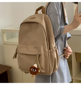 Casual khaki canvas school backpack for students, stylish everyday travel daypack.
