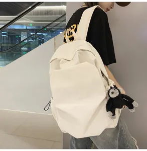 Casual minimalist beige canvas backpack for daily commuting, school, and college students.
