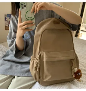 Casual khaki canvas school backpack for women, large capacity stylish daily daypack bag.
