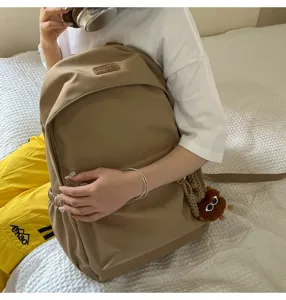 Casual khaki backpack for students and daily use, large capacity school bag with chic design.